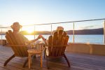 Couple relaxing and drinking wine and holding hands