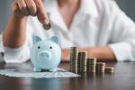 Saving investment banking finance concept. Stack of coins with piggy bank on the table. Growth of loan and investment business idea. Asset Management, Funds, Liabilities, Deposits, Income, Successful.