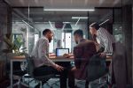 Team Collaboration in a Modern Office with Technical and Digital Discussions